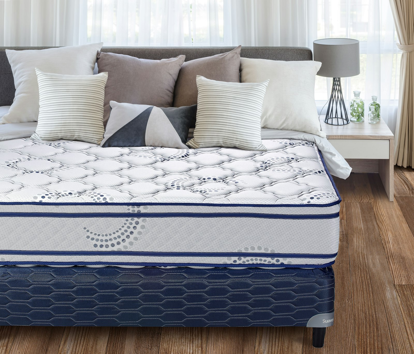 Closeup of a mattress and bedding in a bedroom