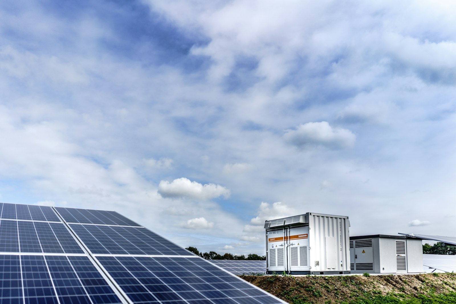 Solar inverters mounted at a ground solar array